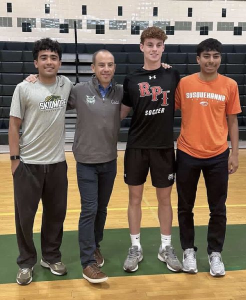 From left to right, Farhad Sharifai, coach Guido Zucconi, Jakob Lindsey and Javier Diaz celebrate their commitments to playing Division III soccer at their respective colleges during the Senior Signing Ceremony on May 22. Zucconi is extremely proud of the trio and not only the work they have done on the field for WJ but also how they have matured off it. “Coaching them has been great,” Zucconi said. “I've never had a problem with them, and just like any family, we've had our fights, but it's always been super mature. I'm really impressed by how three young men have taken coaching, instructions and stood up for themselves when needed. We've always found a way to come together at the end, even if we were frustrated with each other.” (Courtesy @wjboyssoccer via Instagram)