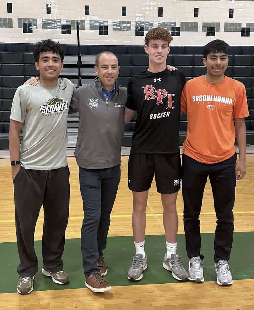 From left to right, Farhad Sharifai, coach Guido Zucconi, Jakob Lindsey and Javier Diaz celebrate their commitments to playing Division III soccer at their respective colleges during the Senior Signing Ceremony on May 22. Zucconi is extremely proud of the trio and not only the work they have done on the field for WJ but also how they have matured off it. “Coaching them has been great,” Zucconi said. “I've never had a problem with them, and just like any family, we've had our fights, but it's always been super mature. I'm really impressed by how three young men have taken coaching, instructions and stood up for themselves when needed. We've always found a way to come together at the end, even if we were frustrated with each other.” (Courtesy @wjboyssoccer via Instagram)