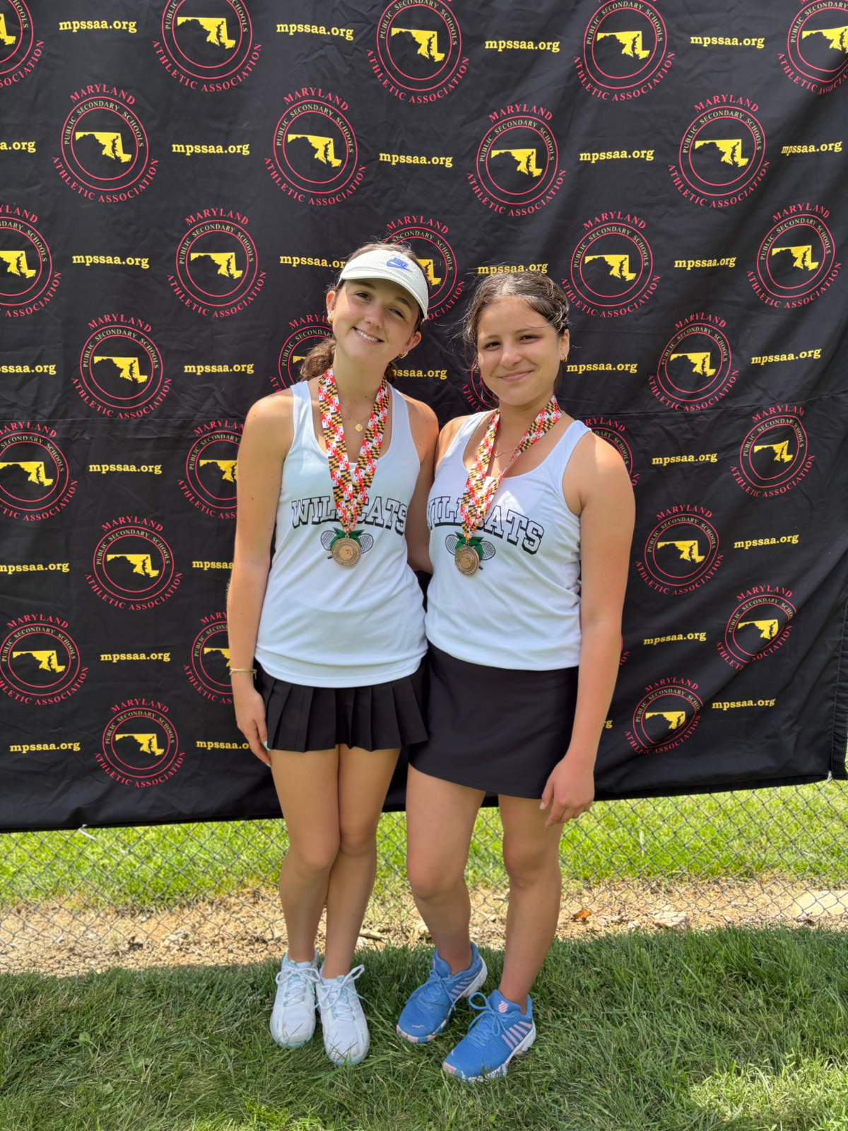 Junior Marie Boy and sophomore Zoe Rojas pose after placing third in the MPSSAA state tournament. The duo lost in the semifinals to RM side Ellen Bu and Jiajing Zheng.