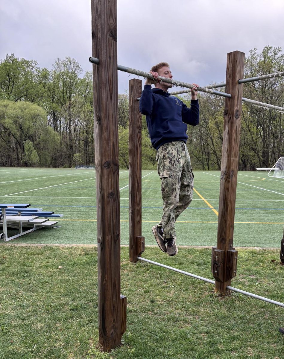 Senior Oliver Farrell completes a pull-up as part of his physical examination to be admitted to NSWOC. (Courtesy Oliver Farrell)