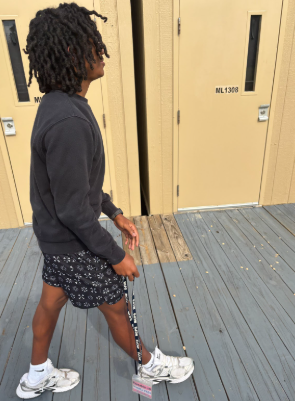 Sophomore Jackson Nathan leaves class with a physical hall pass after his teacher accepts his digital one via Synergy. Upon approval, security guards can now see that Nathan has exited class and is on his way to his destination, the lower floor restrooms.
