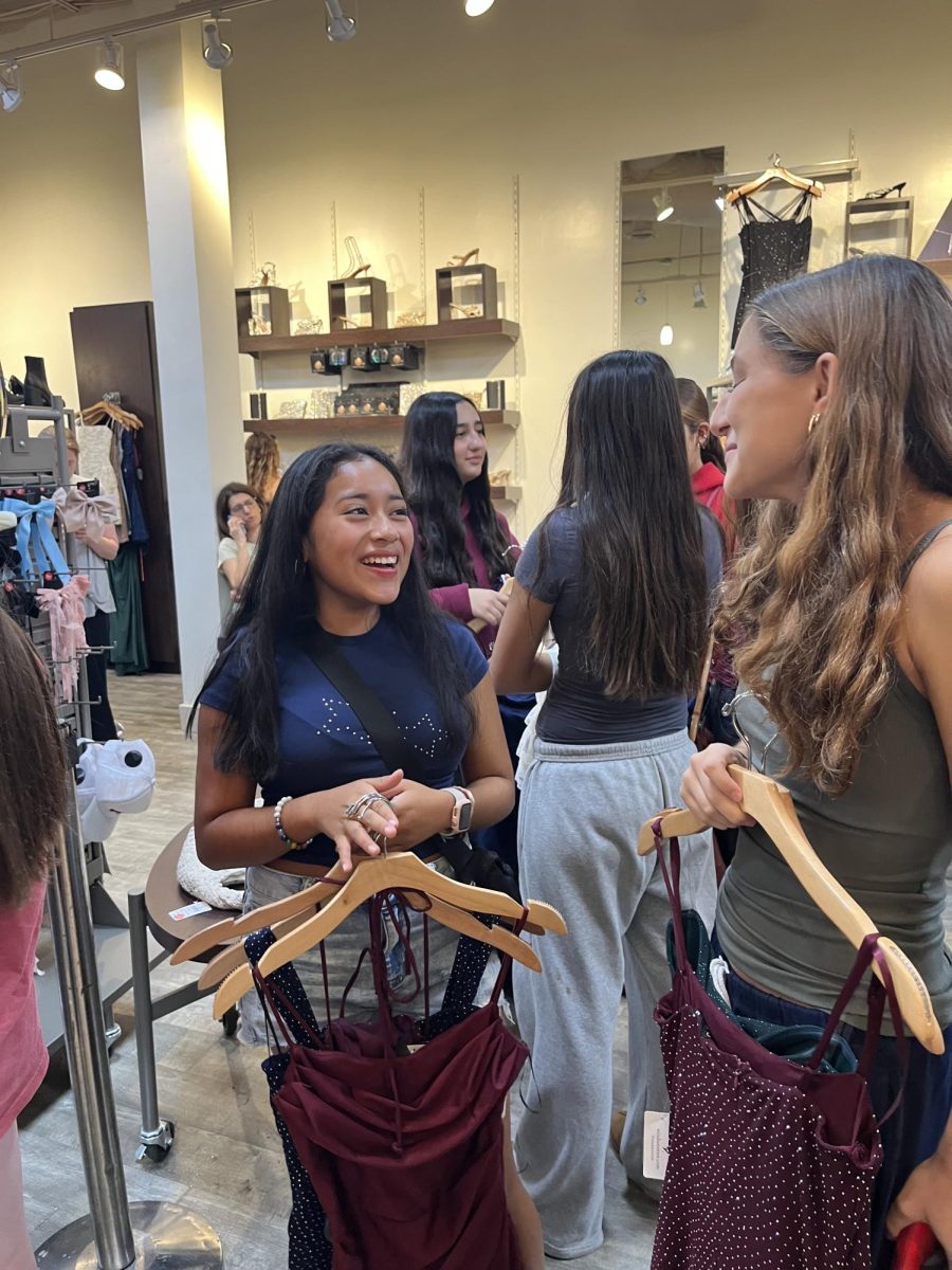 Students select Homecoming dresses to try on at Windsor. The Westfield Montgomery Mall is a popular destination for people to find their Homecoming dresses, as it has multiple stores with a variety of dress options.