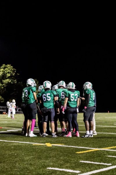The Wildcats gather in the huddle to regroup their offensive tactics. The Wildcat offense was held to 13 points by the Screaming Eagle defense. (Courtesy Isaac Leventhal)