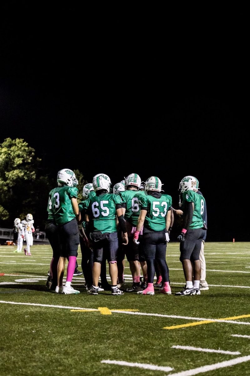The Wildcats gather in the huddle to regroup their offensive tactics. The Wildcat offense was held to 13 points by the Screaming Eagle defense. (Courtesy Isaac Leventhal)