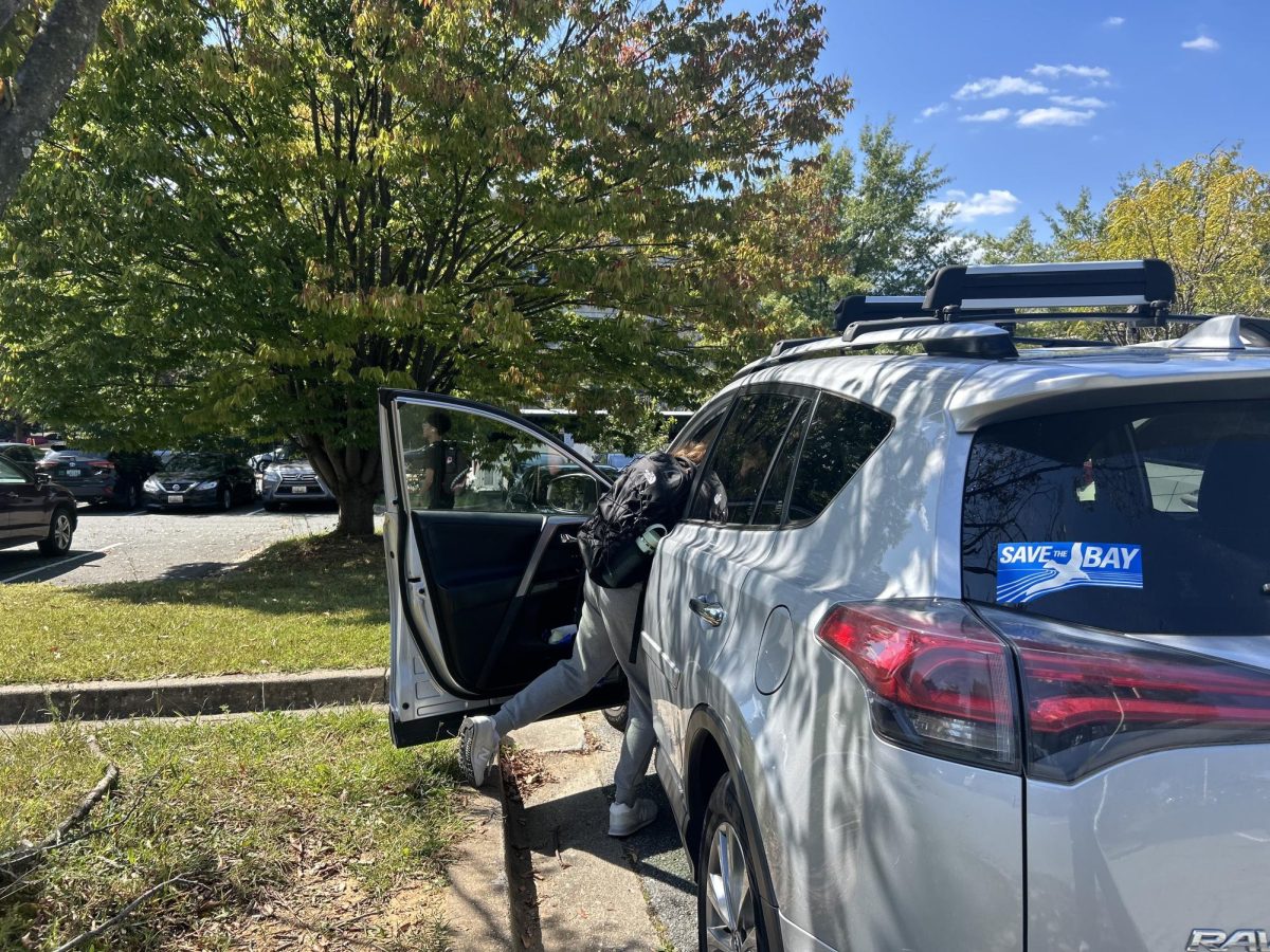 Junior Chloe Russ gets in her car, which is parked in the student lot without a visible parking permit. "I parked after my appointment, I didn't think it was a big deal even though I technically dont have a parking pass" Junior Chloe Russ said.