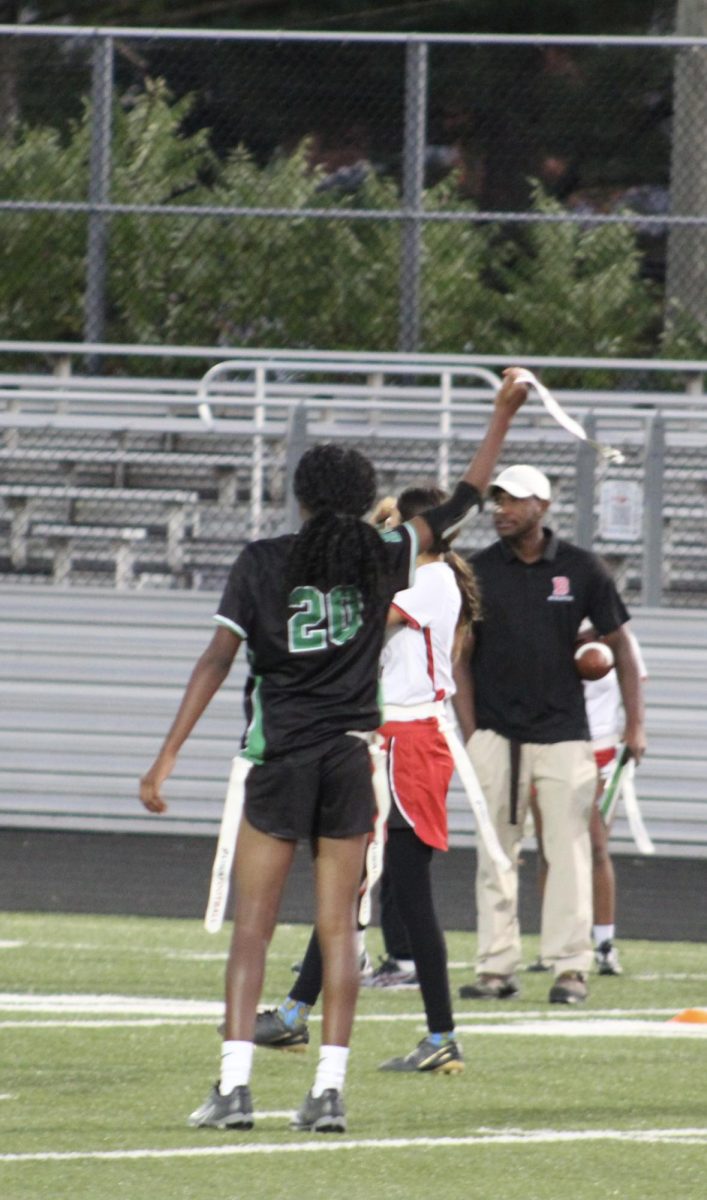 Freshman defender Jade Sneed holds up a Blair offensive players flag, signaling to the referee that the play needs to pause. Flags were raised all night due to the back and forth of the two dominant teams looking to add a win to their record.