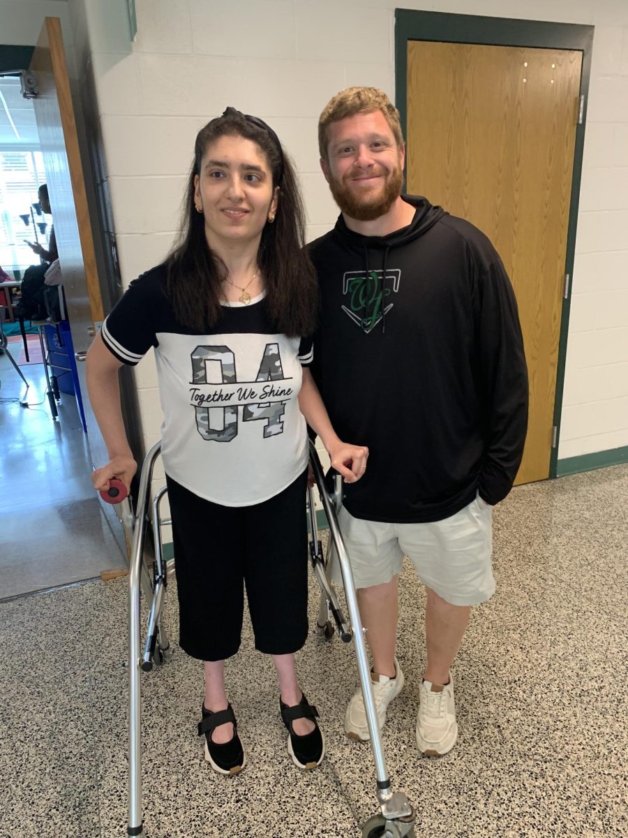 New LFI teacher Matt Miller poses with one of his students outside his classroom. Miller is always taking time to connect with his students on a personal level. (Courtesy Matt Miller)