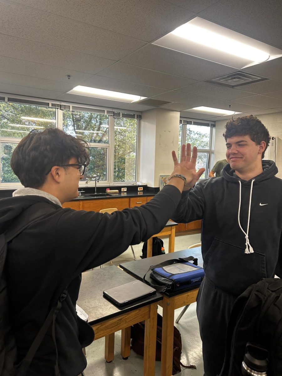 Senior Drew Hochman and Junior Eduardo Rojas share an awkward moment as one goes for a fist-bump and the other a high-five. High-five vs fist-bump may be a controversial topic but, what's even worse is when you mismatch the two. 