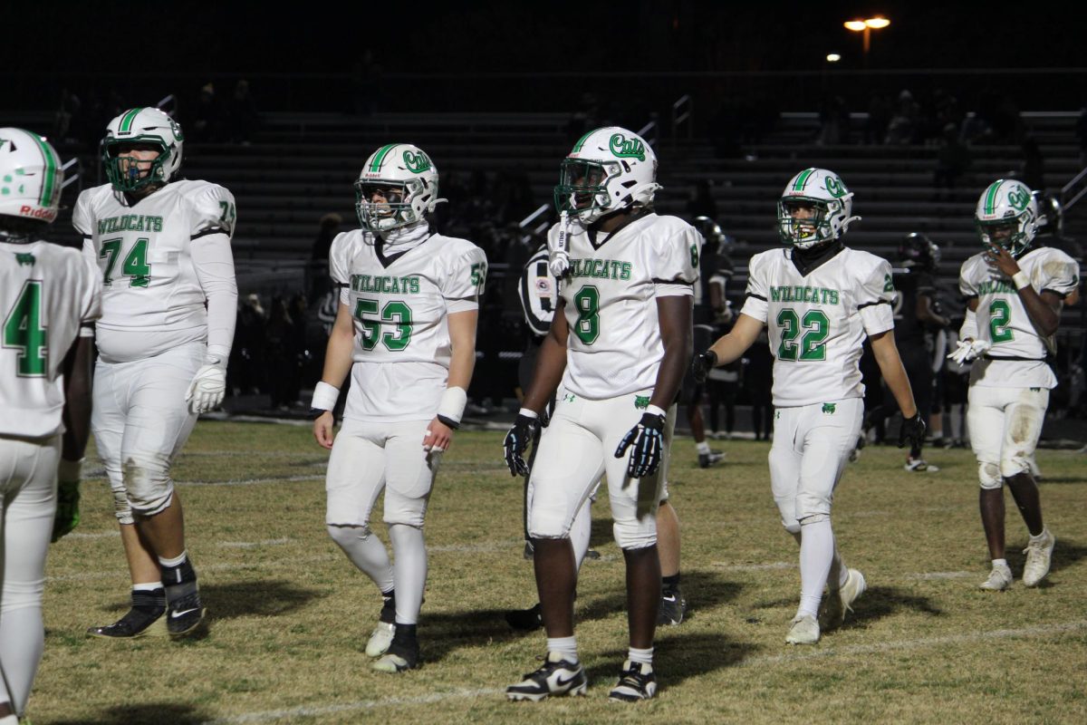 The Wildcats offense, led by senior captain Tauren Sirleaf and senior Andrew Carrado walk off the field to switch lines with defense after turning the ball over.  Turnovers were a common sight for the Cats in their loss for the Jaguars.