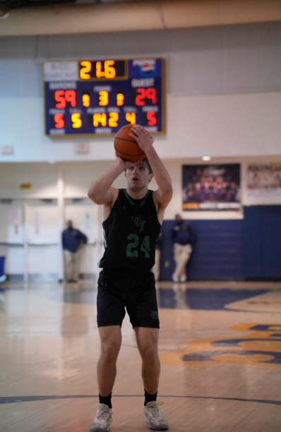 Senior Will Kreisle sinks his second free throw in a heated rivalry match against BCC. Kreisle shot 81% from the line last season. (Courtesy Lifetouch)