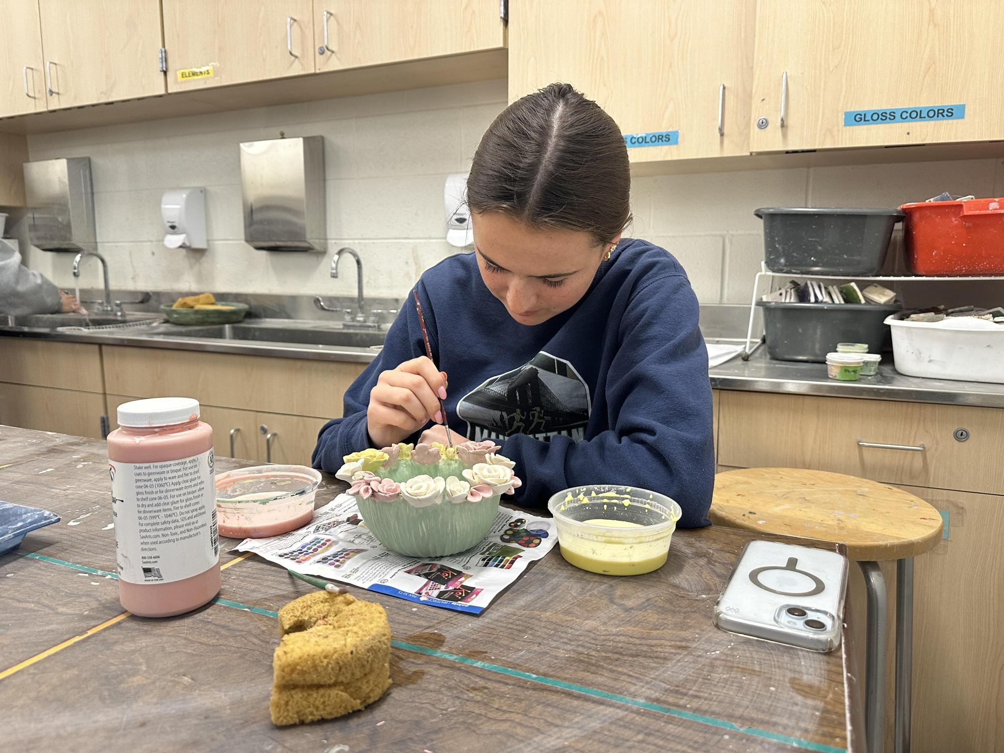 Senior Annie Linkie works on her third piece. When she initially started this project, she still wasn't sure about her Sustain Investigation, but had to start working on something.