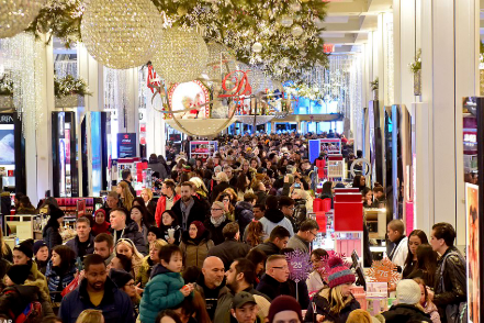 Shoppers are crowding in stores to buy Black Friday deals. Black Friday brought in thousands of people to shop the best deals. Black Friday's name originally described financial chaos. (Courtesy Daily Mail)
