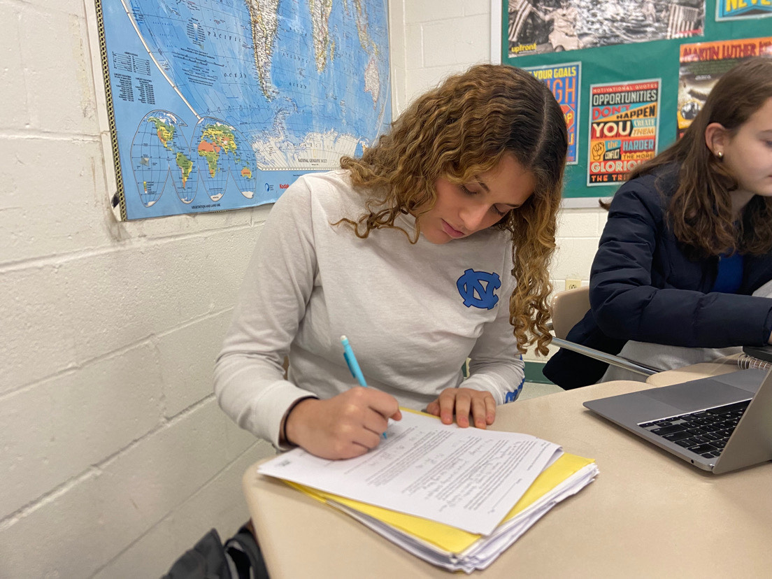 Senior varsity dive member Shoshana Berger finishes her AP coursework during first period after an early morning practice. Berger prepared for the end of the semester as she balanced her meets and early practice