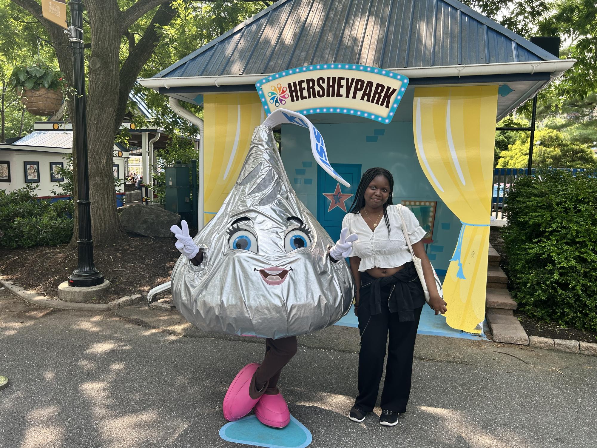 Senior Vania Charo poses with the Hershey Kiss at Hershey Park. WJ students will now have to go to different amusement parks like Hershey Park instead of Six Flags.(courtesy Lee Zoe Randriatahina)