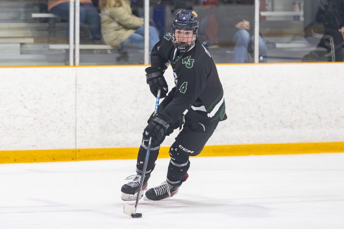 Junior defenseman Matthew Corwin glides through the neutral zone, poised with the puck as the Icecats have continued to control the tempo on the ice. (Photo Courtesy of Matthew Corwin)