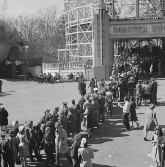 During the Great Depression, a line of Glen            
Echo Park visitors wait patiently for the Coaster Dips ride. The wooden coaster, known for its thrilling double drops, was a major attraction from 1921 until the parks closing in 1968.