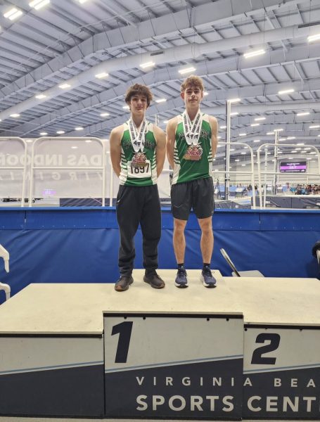 Navigation to Story: Indoor track team progress through mid-season