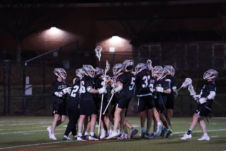 WJ lacrosse players celebrate a huge opening win against Blair last season. (courtesy Spencer Robinson)