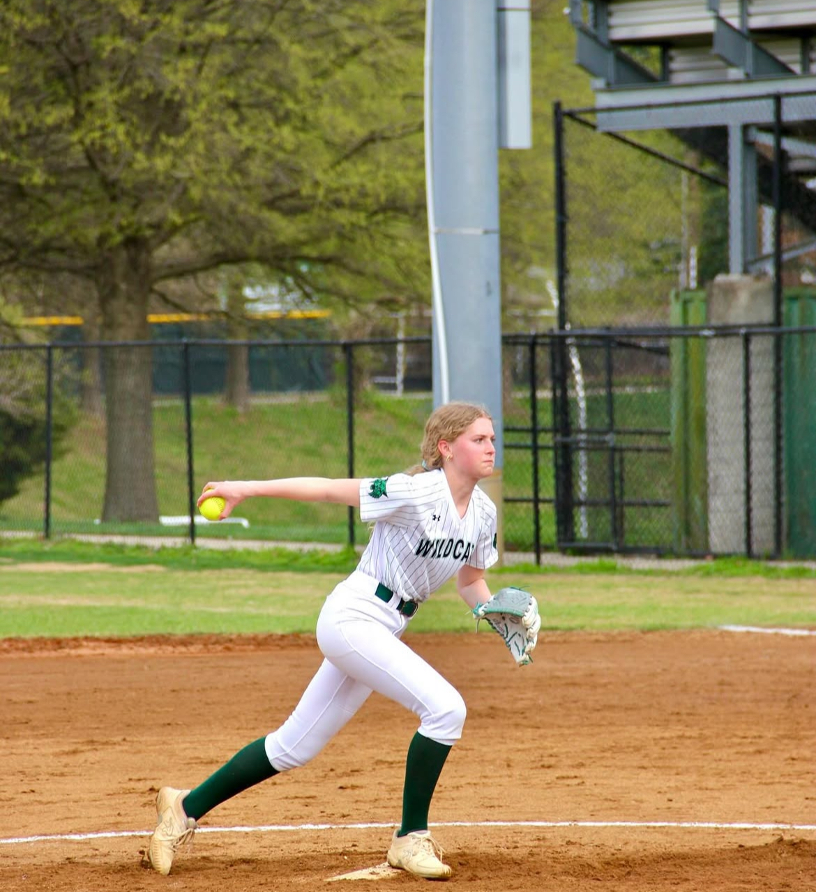 Sophomore pitcher Lizzie Robinson winds up to deliver a pitch to home plate. Robinson, along with fellow sophomore pitcher Logan Strbak, is going to have to exhibit solid play on the mound to help the team achieve a successful season. (Courtesy Liam Snow)