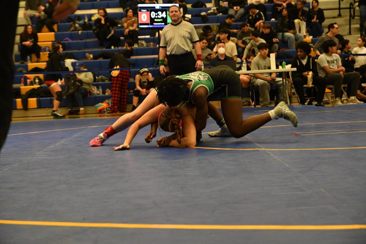 Senior Sonia Pegoue secures control during her match at the MCPS County Championships at Gaithersburg High School, where she went on to earn her third county title and the Helen Maroulis Award. (Courtesy Bamdad Hajati)