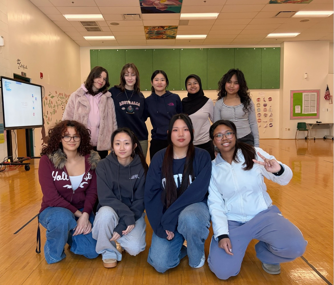 Members of KPRO club pose in the yoga studio, where they practice Mondays and Thursdays for about two hours. (Courtesy Lina Yu)