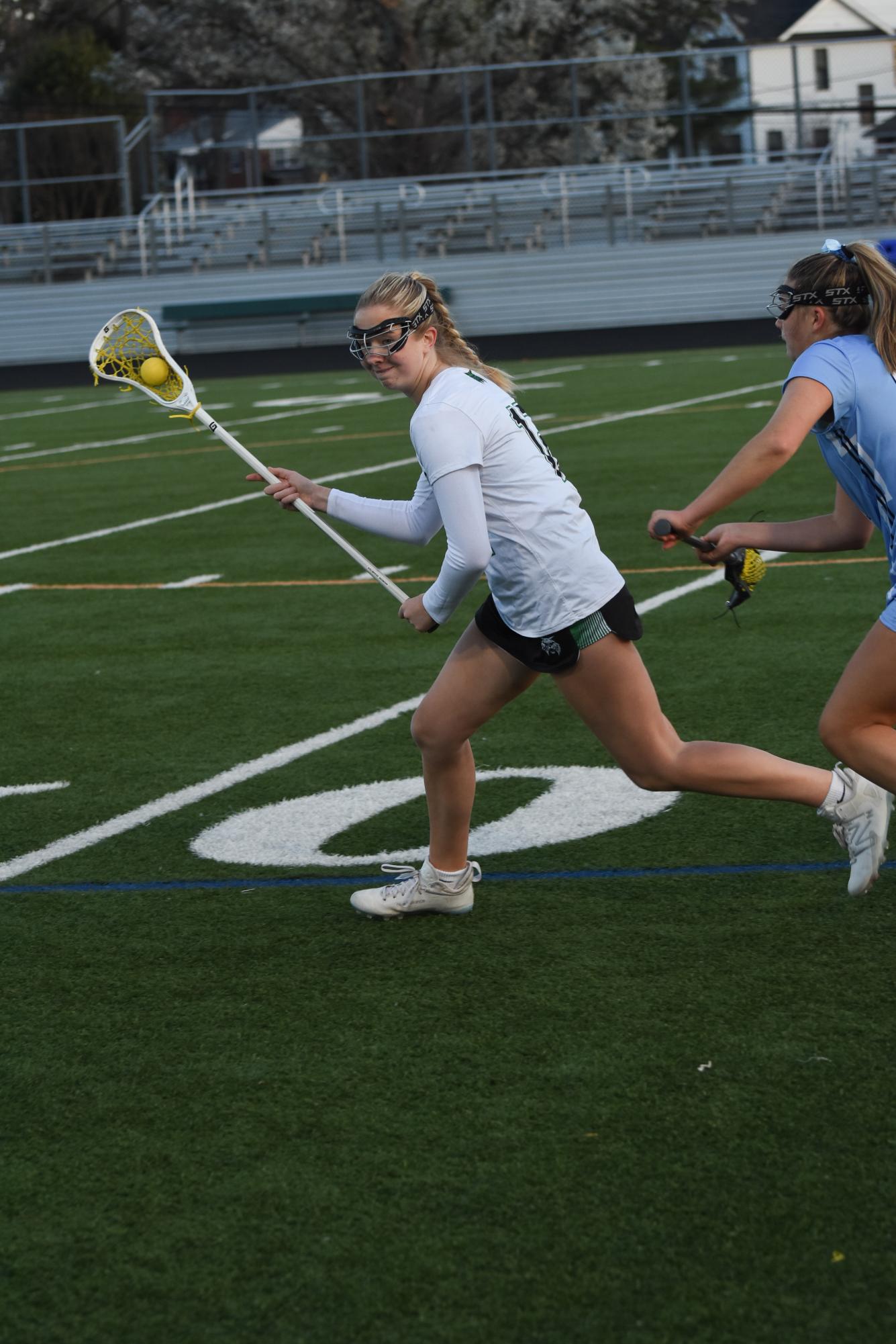 Senior captain Eloise Hill cradles past her defender, advancing the ball into the Wildcats’ attacking third.
