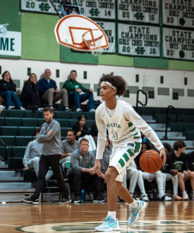Brooks dribbles up the ball as a point guard in a home game. Brook's responsibility as a point guard cannot be overstated, as he has to set the tone for the other players on the court. "The next development in Carter's career and for basketball would be his leadership skills. As the point guard, it's an extension of the head coach, so it would be really important for him to kind of develop those skills more." (Courtesy Carter Brooks)