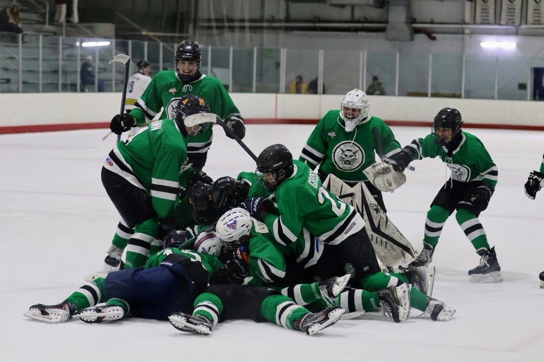 After junior Cameron Fischer buried the game-winner, the Wildcats stormed the ice and dogpiled thier teammate in celebration, sealing a 3-2 state victory in unforgettbale fashion. (Courtesy of Matthew Corwin).