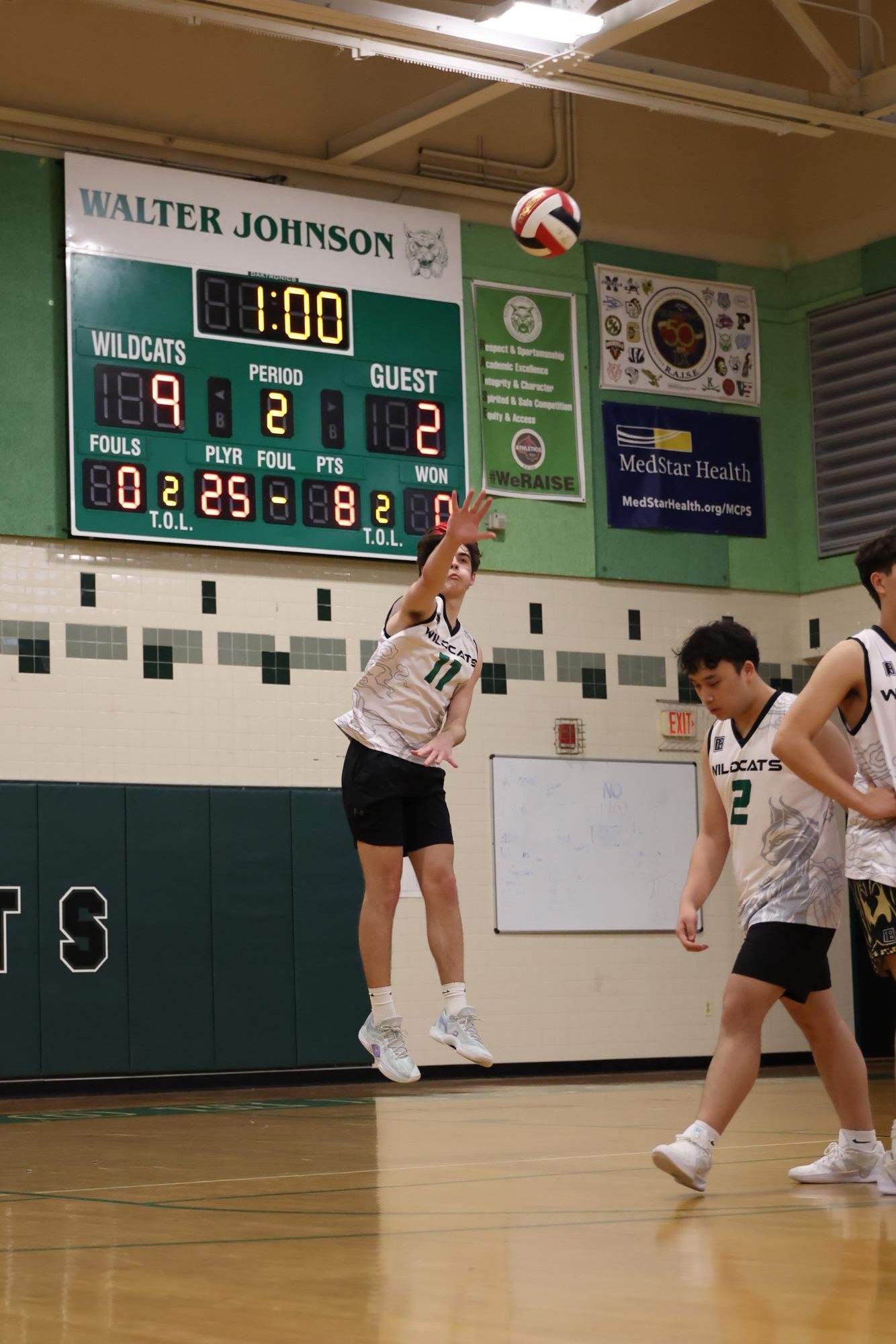 Senior middle Peter Yankov hits the ball in a game last year against Poolesville. The Cats beat the Falcons in the match and will seek to turn their 5-1 record at home to an undefeated one.