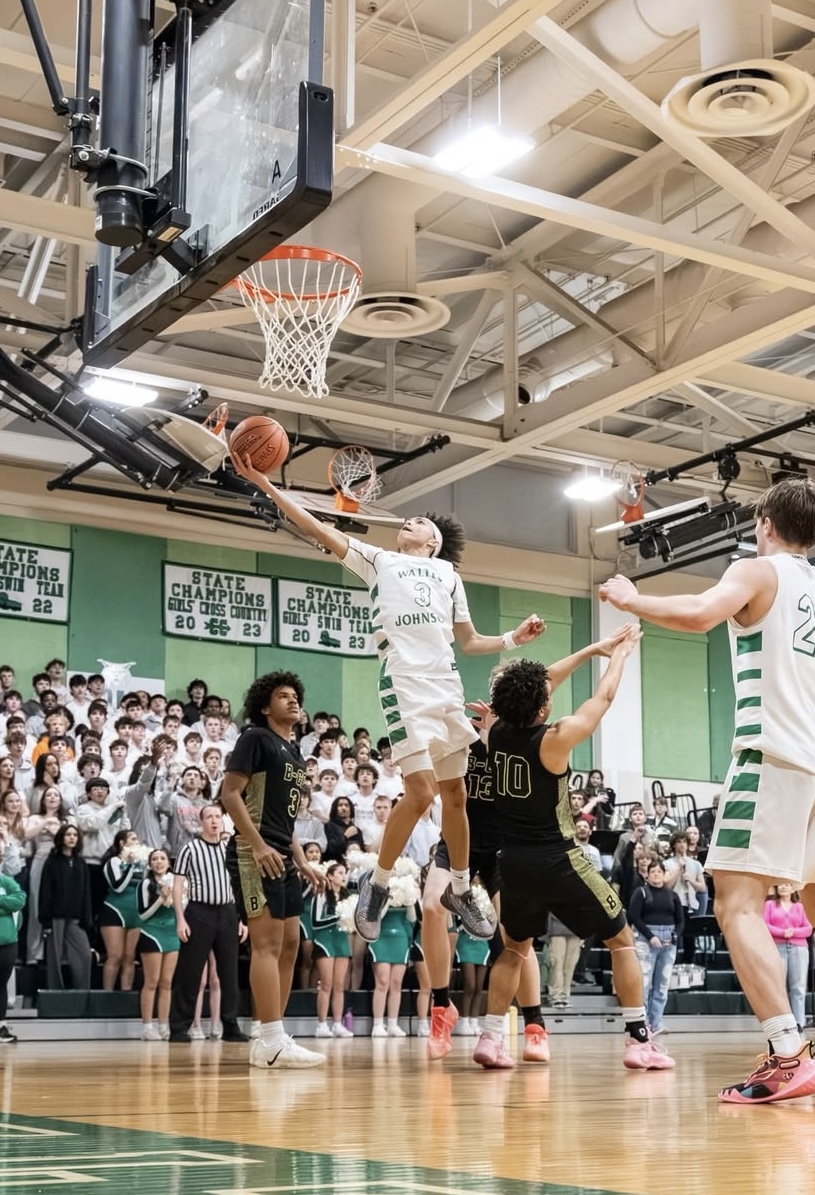 Sophomore point guard Carter Brooks goes inside for a layup in the Regional Semifinals matchup against B-CC on March 2. Brooks played a crucial part in his sophomore campaign, helping elevate the team to the Regional Finals with a 53-42 win over the Barons.
