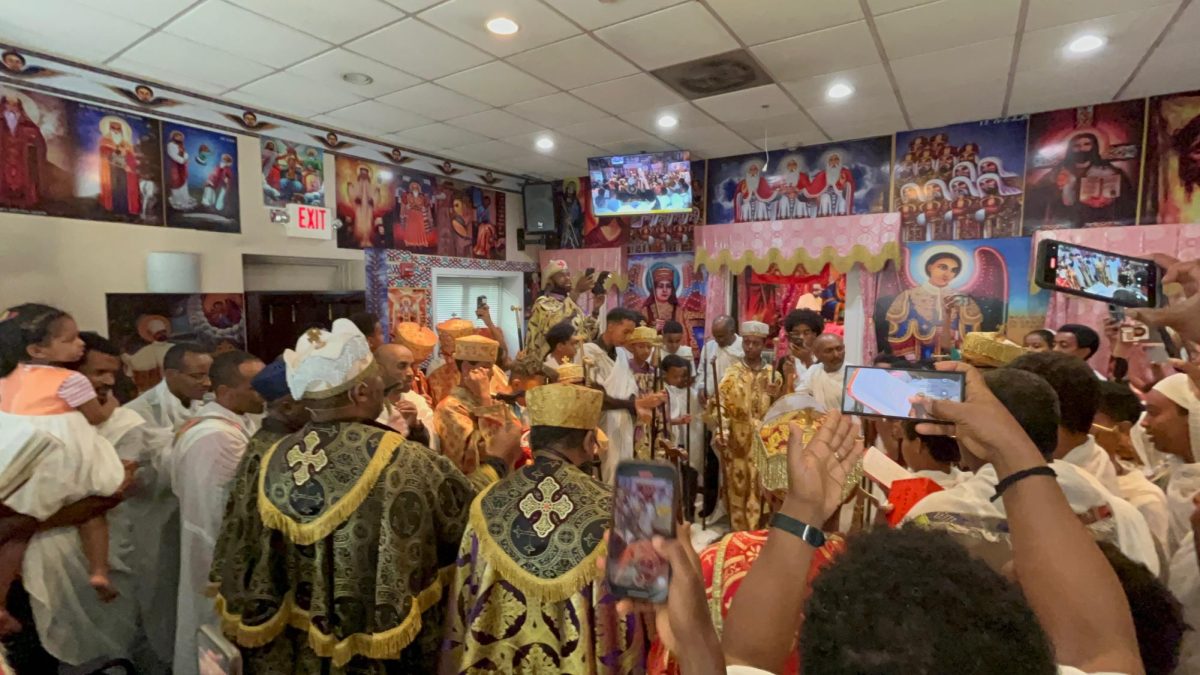 Congregants of Yonnes Church gather together for  Good Friday which is called Arbi Siklet in the Ethiopian Orthodox Church. Marken Teklemikael attends church weekly with celebrations like these helping him connect more to his faith and culture. "The people circle around and trap the devil and hit him while chanting in ge'ez which is an ancient language in Ethiopia," Teklemikael said.
(Courtesy Marken Teklemikael)