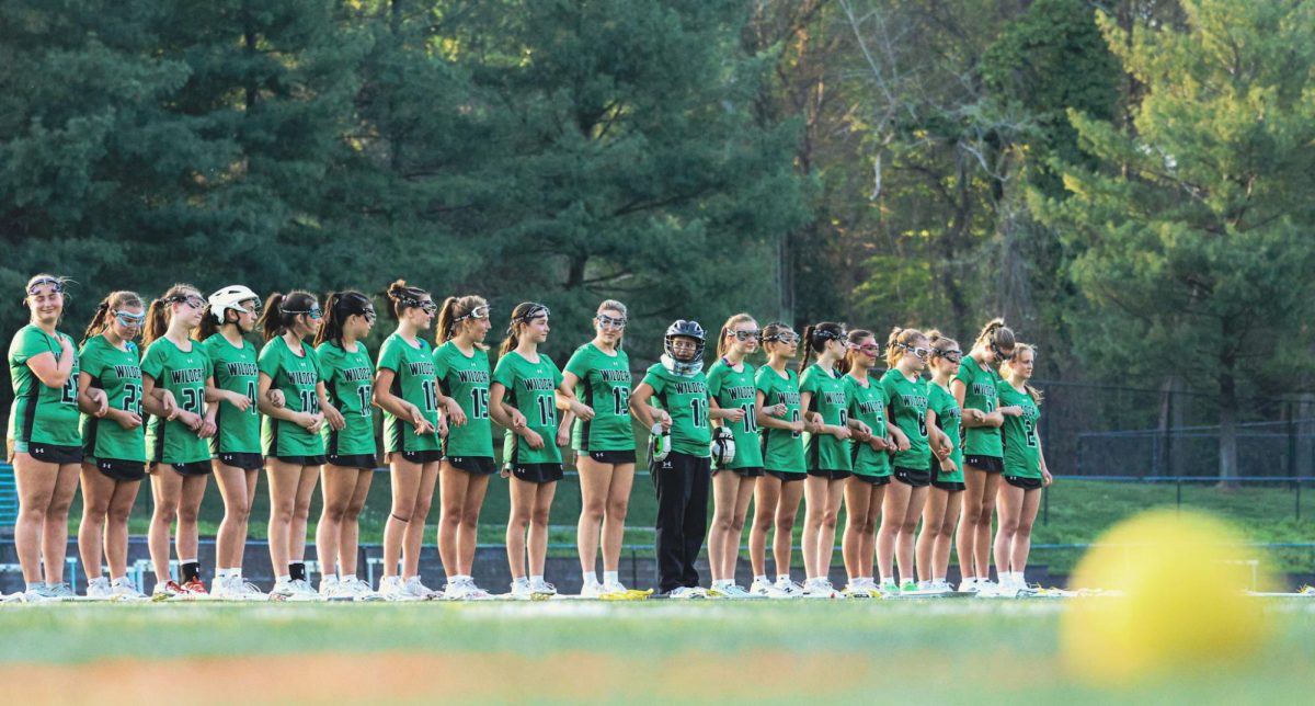 WJ girls lacrosse lines up shoulder to shoulder before their game against Whitman, focused and ready as they prepare to take the field together. The Wildcats were able to pull away from the Vikings, winning 9-8.