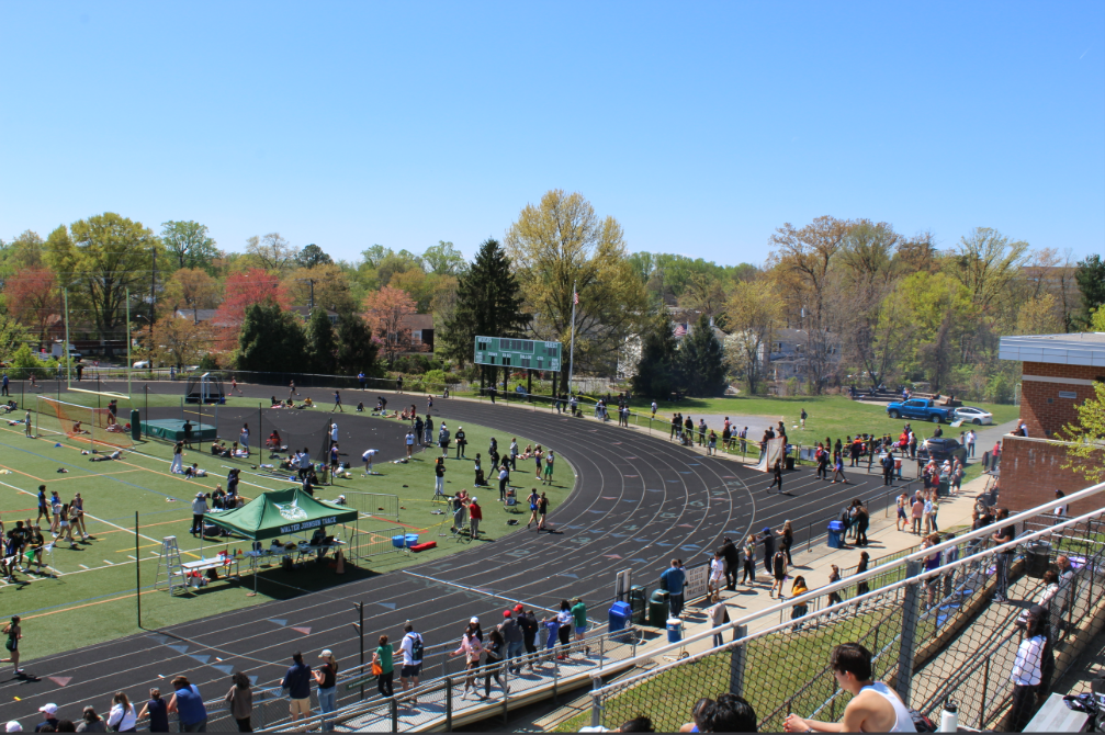 Spring colors and smoke permeate Wildcat field as spectators watch various athletes spring into action in various events. The weather for this meet was perfect, as temperatures around 70 degrees had runners working up a sweat while not overheating them. However, hard work from volunteers manning the grill had the unintended consequence of making it slightly harder for athletes to catch their breath as they had to take in the smoky air.